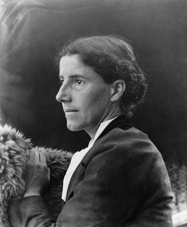 The eleventh episode of *American Woman In Fact and Fiction* was an adaptation of "The Yellow Wallpaper," a short story by Charlotte Perkins Gilman, pictured here. Circa 1900 public domain photograph by C.F. Lummis, restoration by Adam Cuerden, retrieved via [Wikimedia](https://commons.wikimedia.org/wiki/File:Charlotte_Perkins_Gilman_c._1900.jpg).