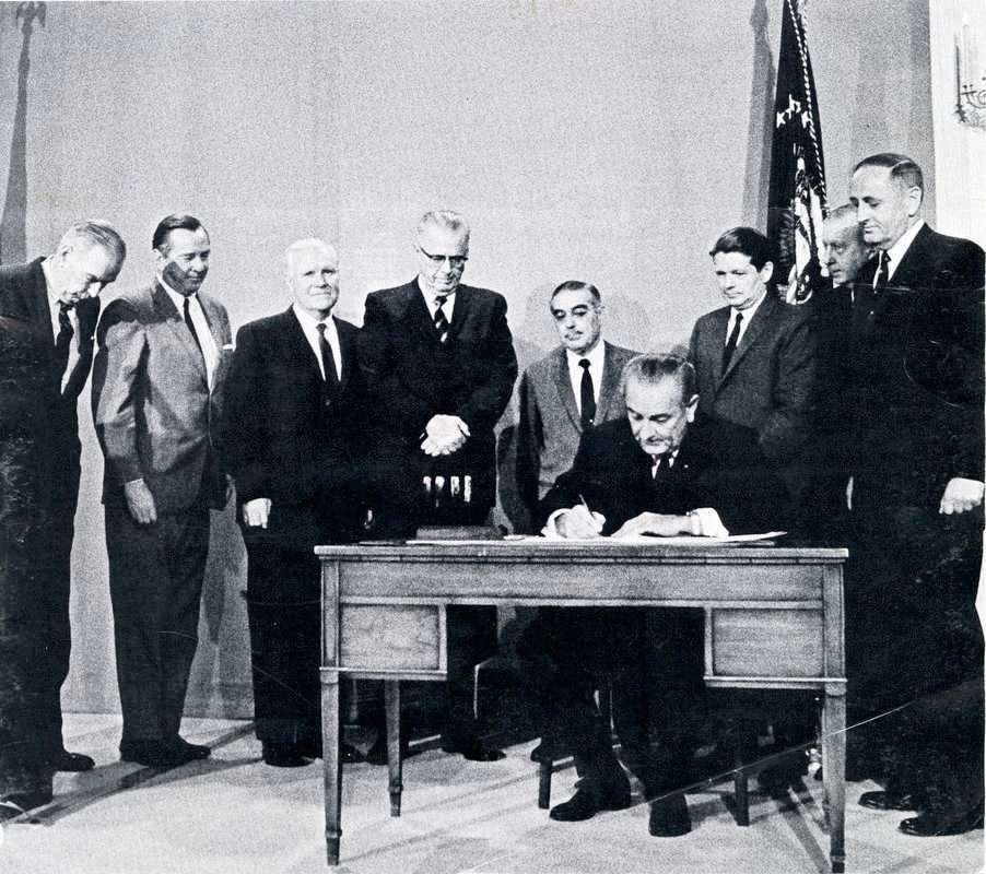 President Lyndon Johnson signs the Public Broadcasting Act on November 7, 1967. Yoichi Okamoto, LBJ Library.