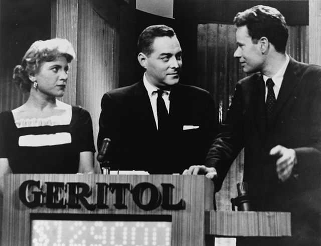 *Ethic for Broadcasting* was produced in the wake of the late 1950s quiz show and payola scandals. Pictured here are contestant Vivienne Nearing, host Jack Barry, and contestant Charles Van Doren on *Twenty-One*, a central subject of the quiz show scandals. 1957 public doman photograph by Orlando Fernandez, via [Wikimedia](https://commons.wikimedia.org/wiki/File:Vivienne_Nearing,_Jack_Barry,_Charles_Van_Doren_NYWTS.jpg).